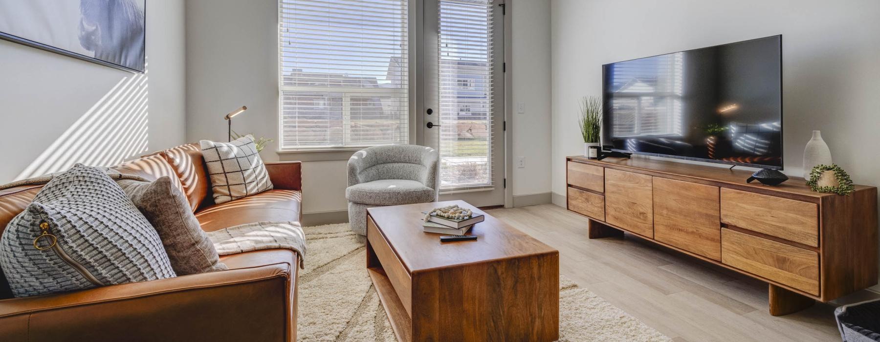 a living room with a tv and couches