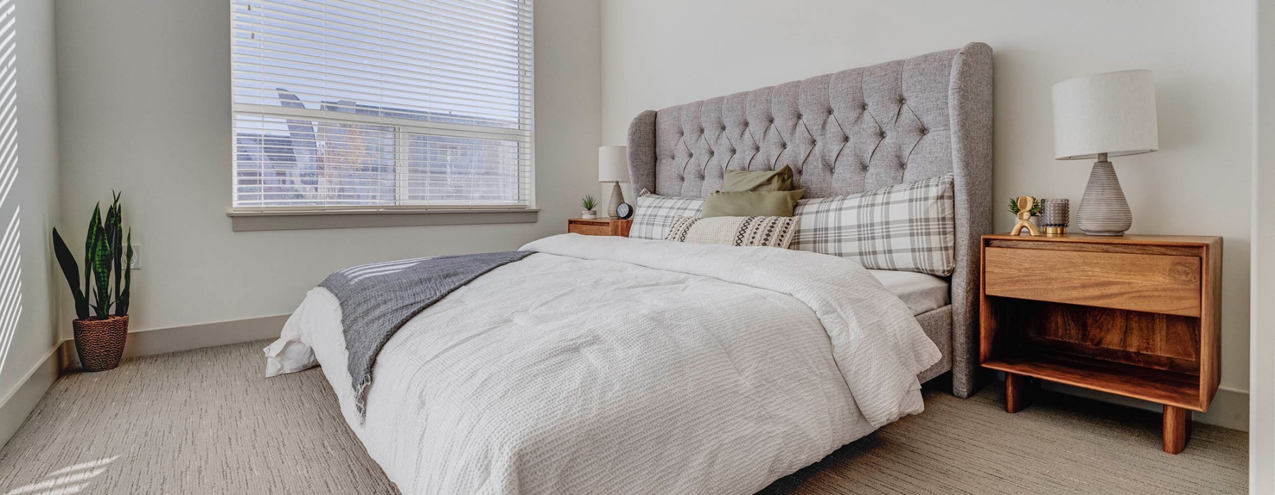a bedroom with a bed and a table