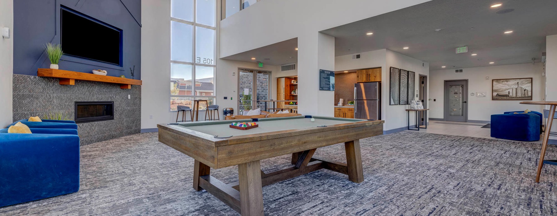 billiards table in two-story clubhouse