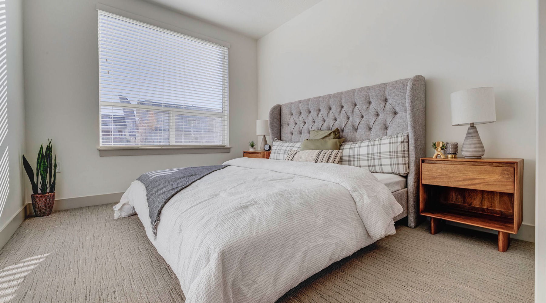 a bedroom with a bed and a table