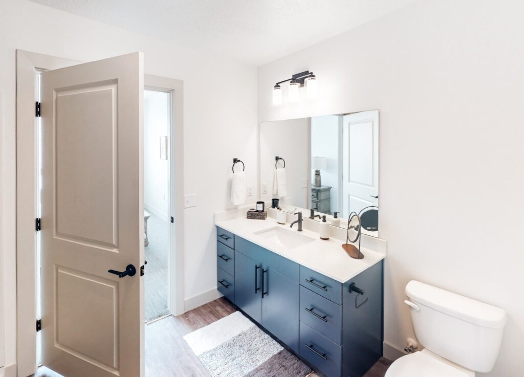 Luxury apartment bathroom with vanity & mirror
